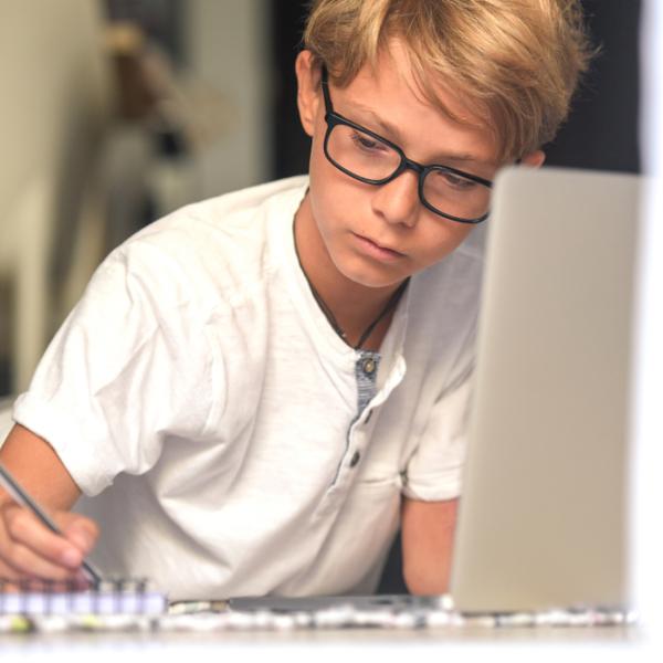 teenage boy working on homework