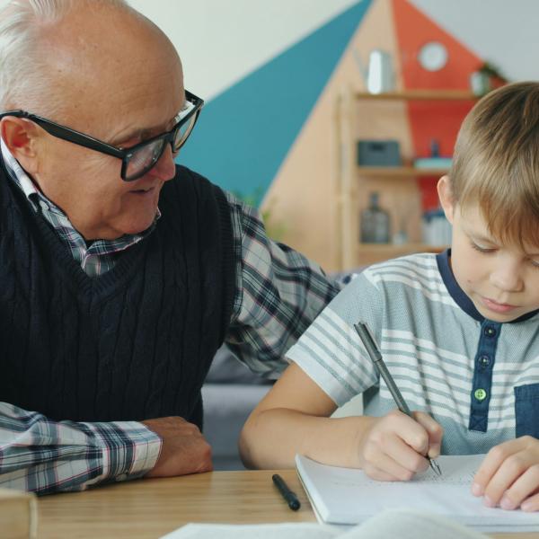 Caregiver helping child with homework