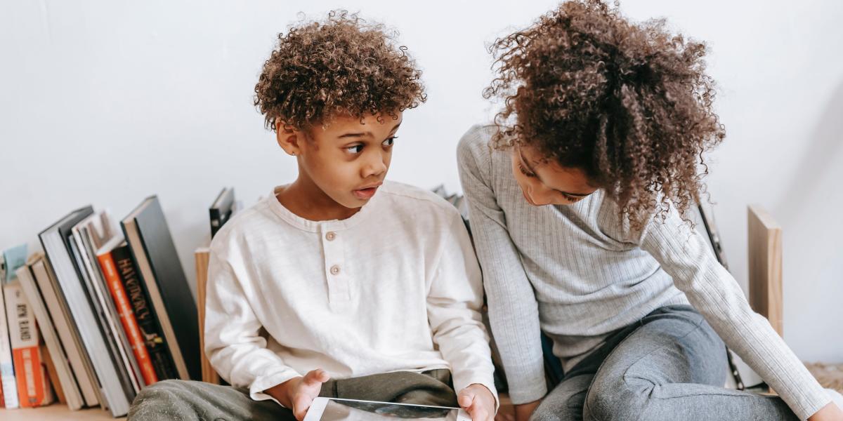 mom and son work on school work at home