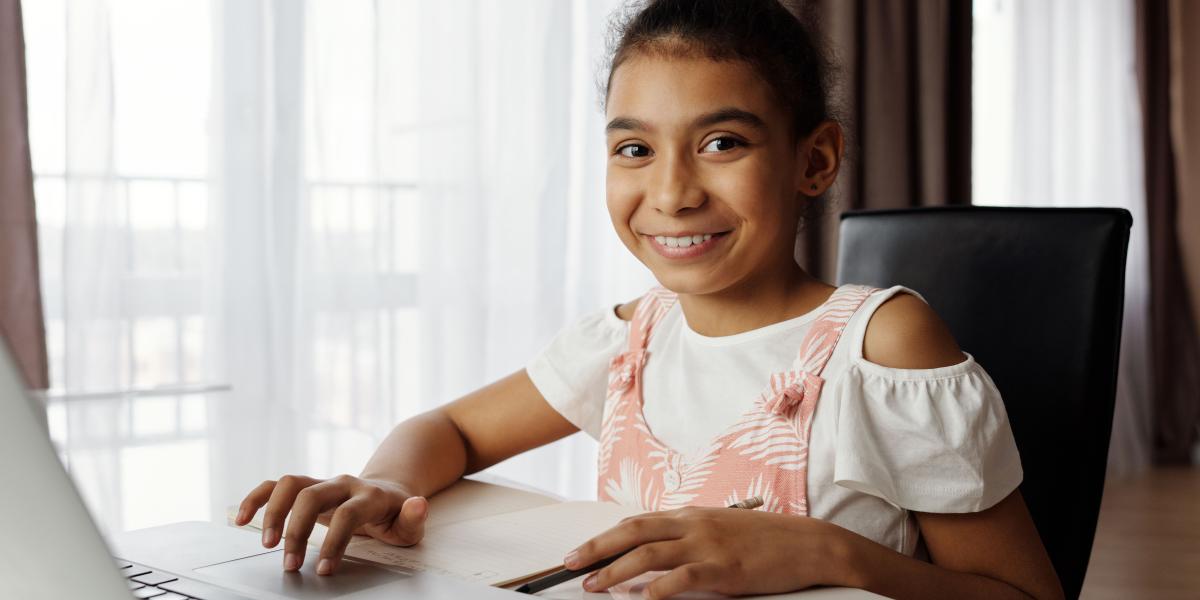 Middle school student working on her laptop